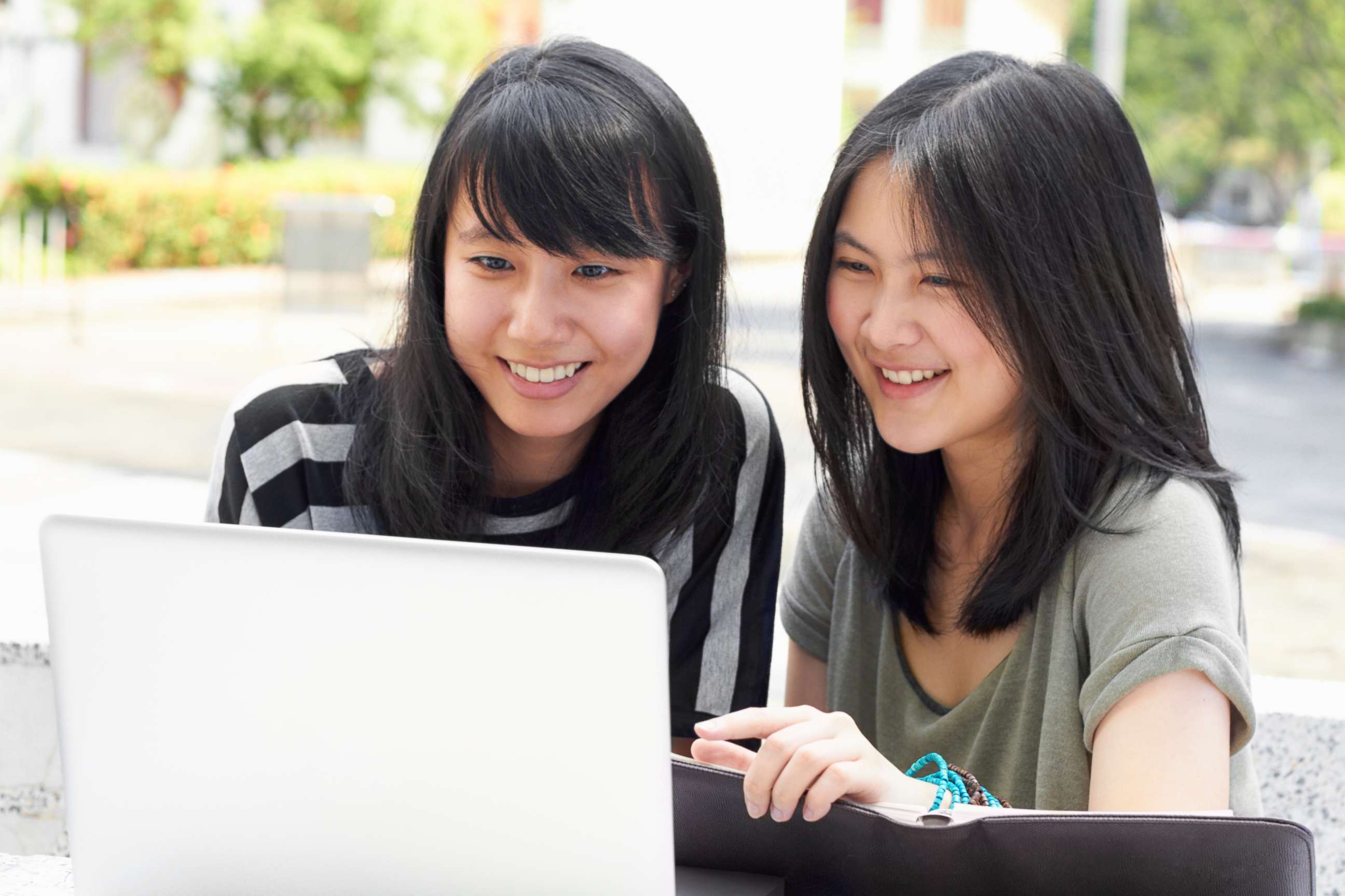 PHOTO: Two students sitting outside together appear in this undated stock photo.