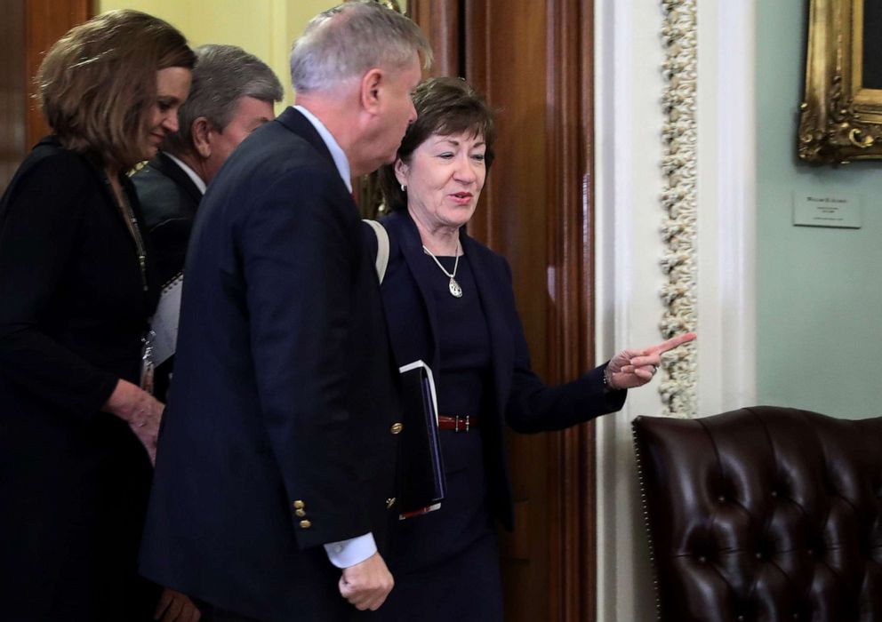 PHOTO: Sen. Susan Collins and Sen. Lindsey Graham are directed to a different entrance to the Senate Chamber before the start of President Donald Trump's impeachment trial at the U.S. Capitol, Jan. 21, 2020, in Washington, D.C.