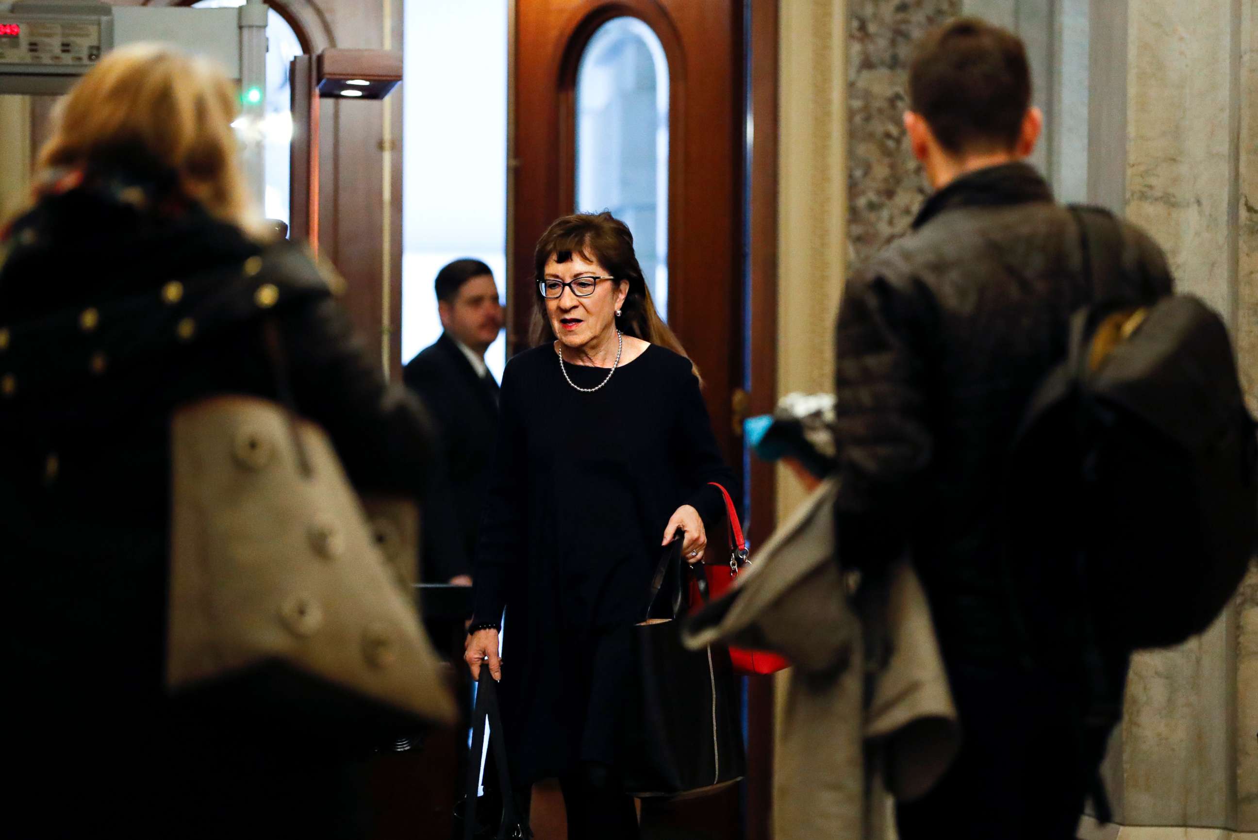 PHOTO: Republican Sen. Susan Collins, of Maine, arrives at the Capitol in Washington during the impeachment trial of President Donald Trump on charges of abuse of power and obstruction of Congress, Jan. 24, 2020.