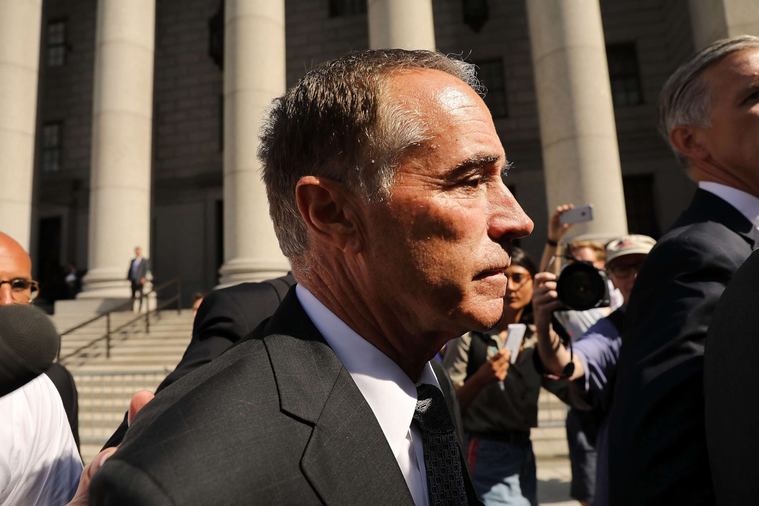 PHOTO: Rep. Chris Collins walks out of a New York court house after being charged with insider trading on Aug. 8, 2018 in New York City.