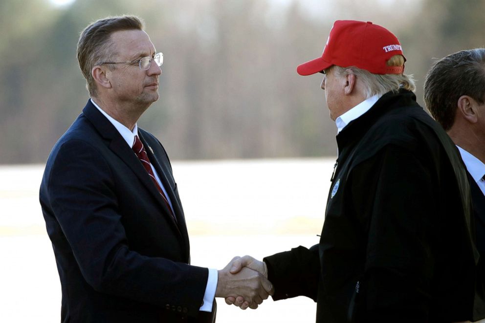 PHOTO: President Donald Trump greets Rep. Doug Collins as he arrives on Air Force One, March 6, 2020, at Dobbins Air Reserve Base in Marietta, Ga.
