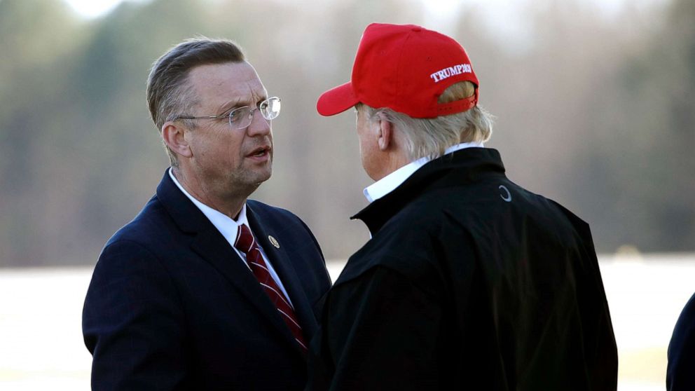 PHOTO: President Donald Trump greets Rep. Doug Collins as he arrives on Air Force One, March 6, 2020, at Dobbins Air Reserve Base in Marietta, Ga.