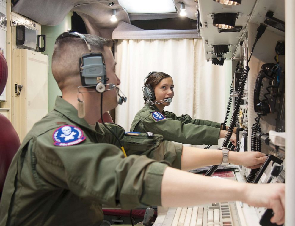 PHOTO: 1st Lt. Pamela Blanco-Coca, 319th Missile Squadron missile combat crew commander, and her deputy commander, 2nd Lt. John Anderson, simulate key turns of the Minuteman III Weapon System Feb. 9, 2016. 