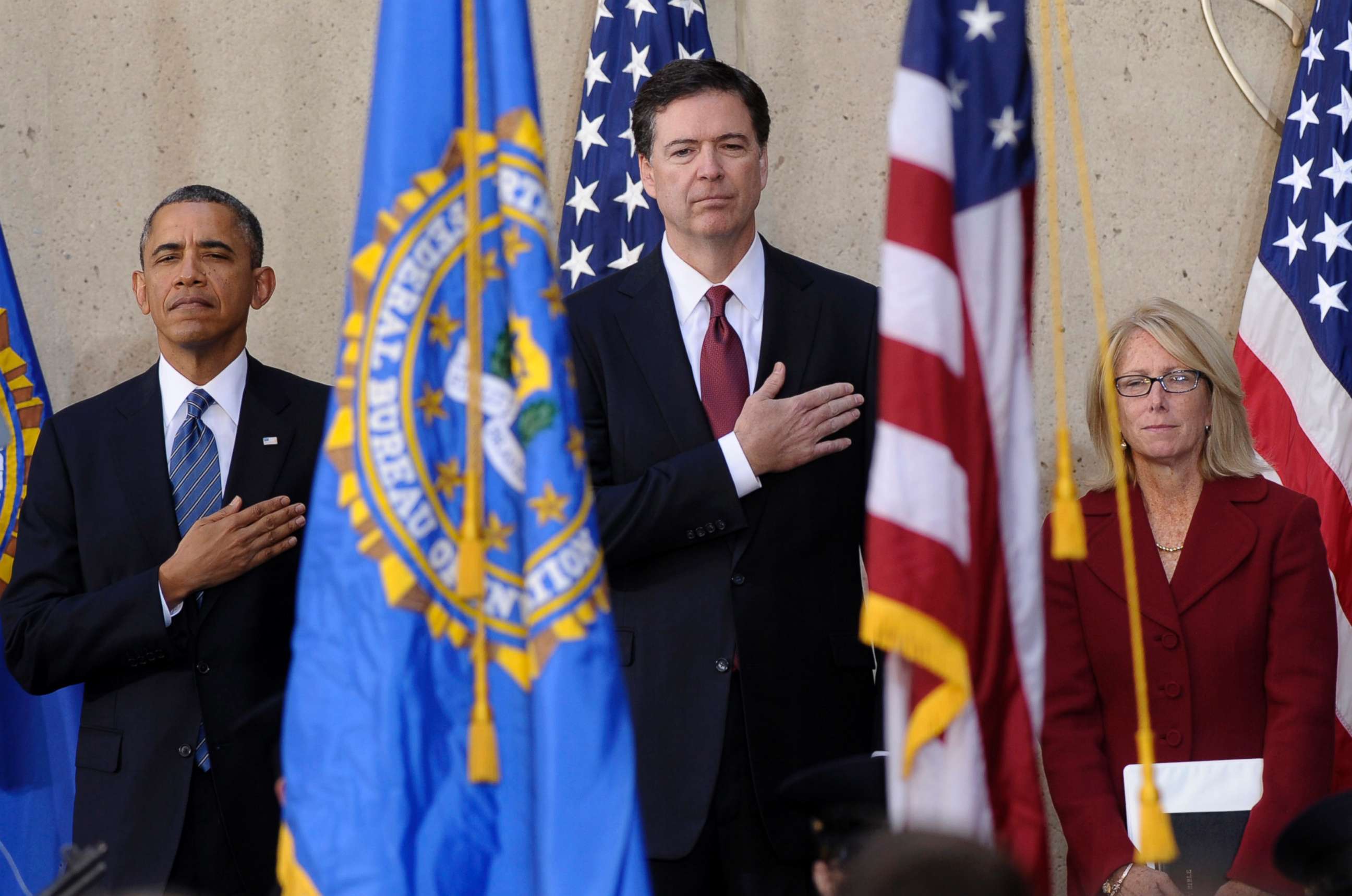 PHOTO: From left, President Barack Obama stands with James Comey  and his wife Patrice Failor during the singing of the National Anthem at Comey's installation as FBI Director, Monday, Oct. 28, 2013, at FBI Headquarters in Washington, D.C.