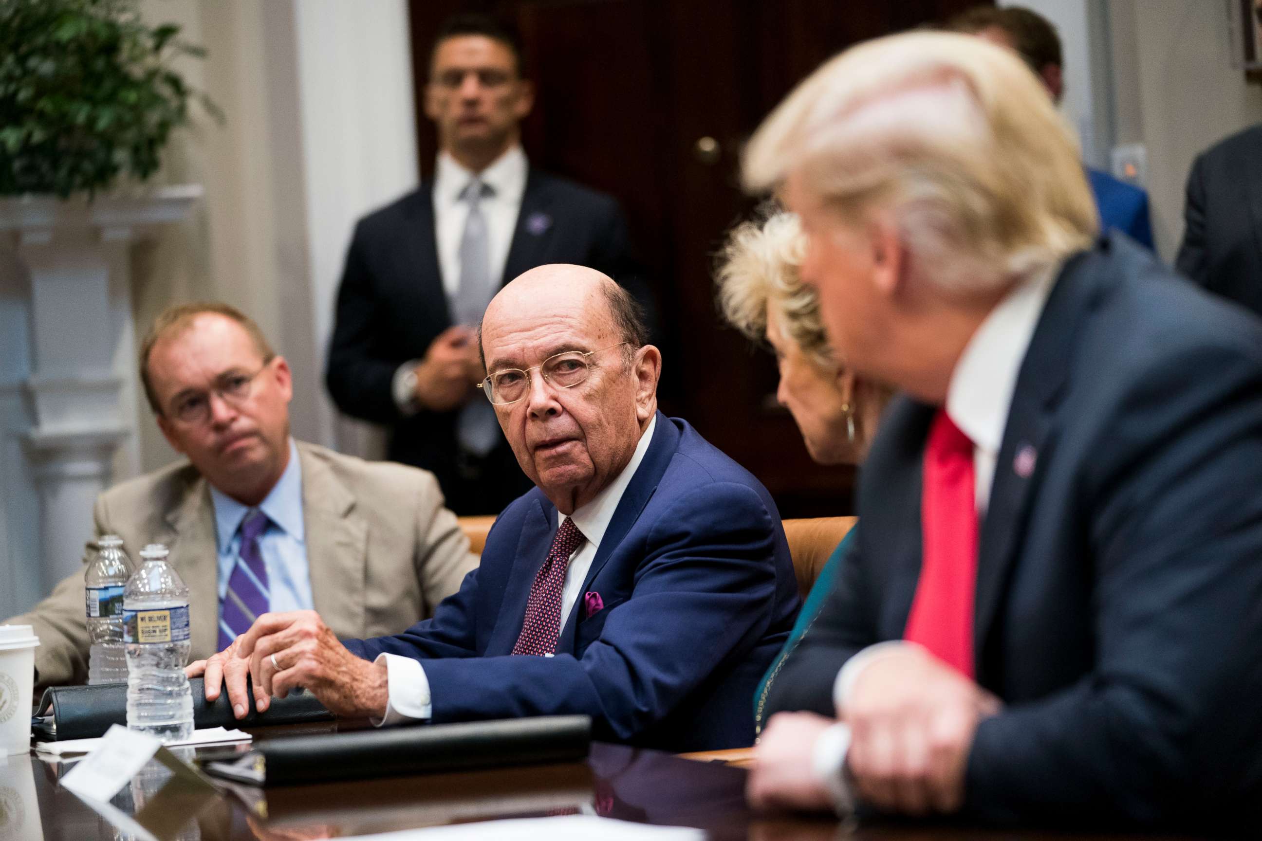 PHOTO: Commerce Secretary Wilbur Ross speaks to President Donald Trump during the first meeting of the President's National Council for the American Worker at the White House in Washington, Sept. 17, 2018.