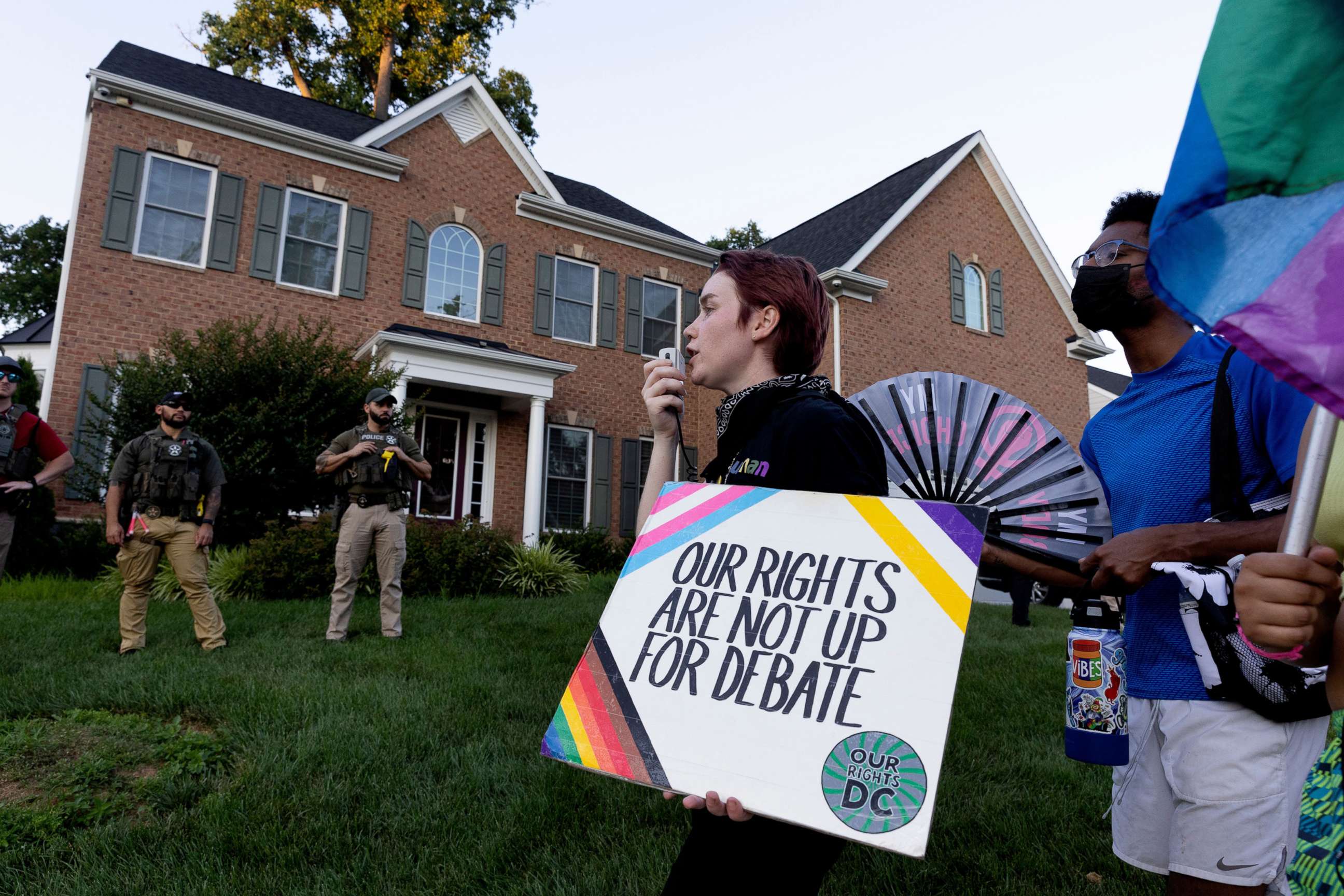 PHOTO: US Marshals watch abortion rights activists march outside the home of conservative Supreme Court Justice Amy Coney Barrett, in Falls Church, Va., June 30, 2022.