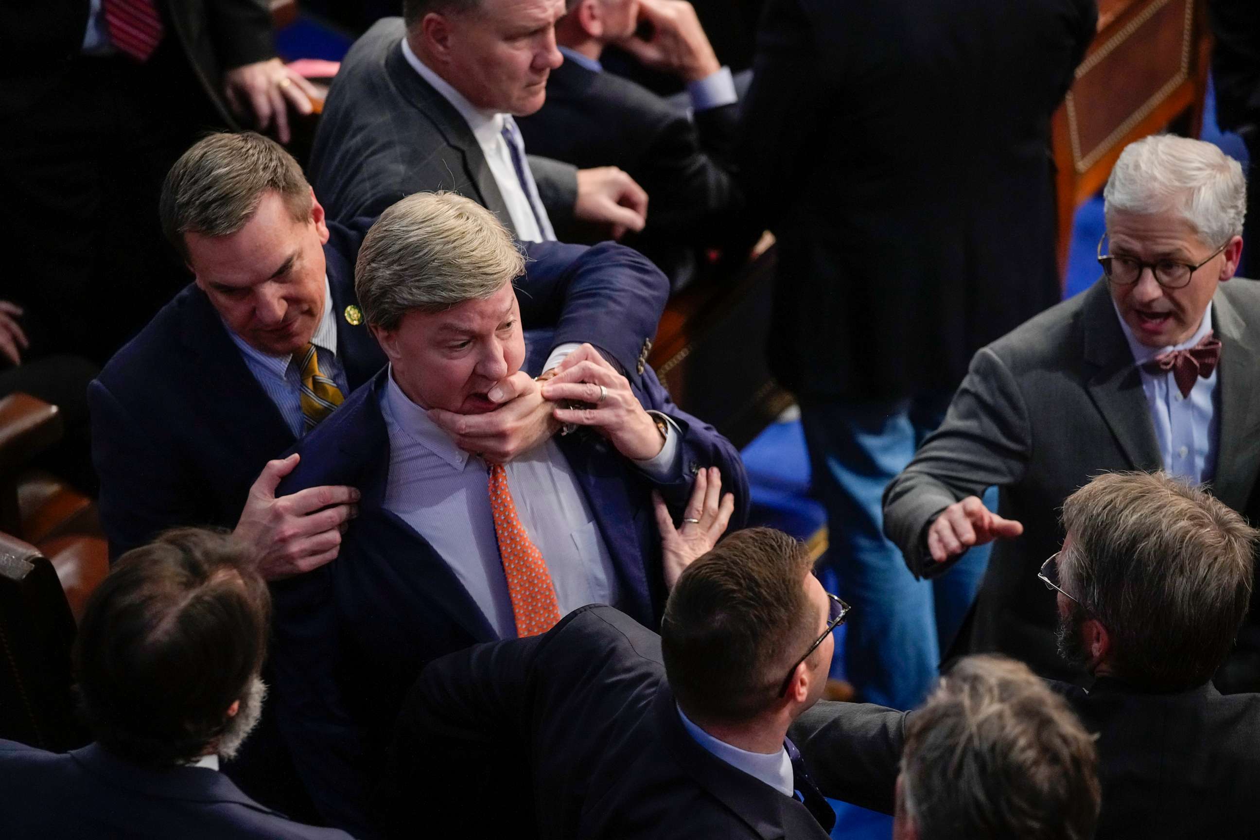 PHOTO: Rep. Richard Hudson, pulls Rep. Mike Rogers, back as they talk with Rep. Matt Gaetz during the 14th round of voting for speaker in Washington, Jan. 6, 2023.