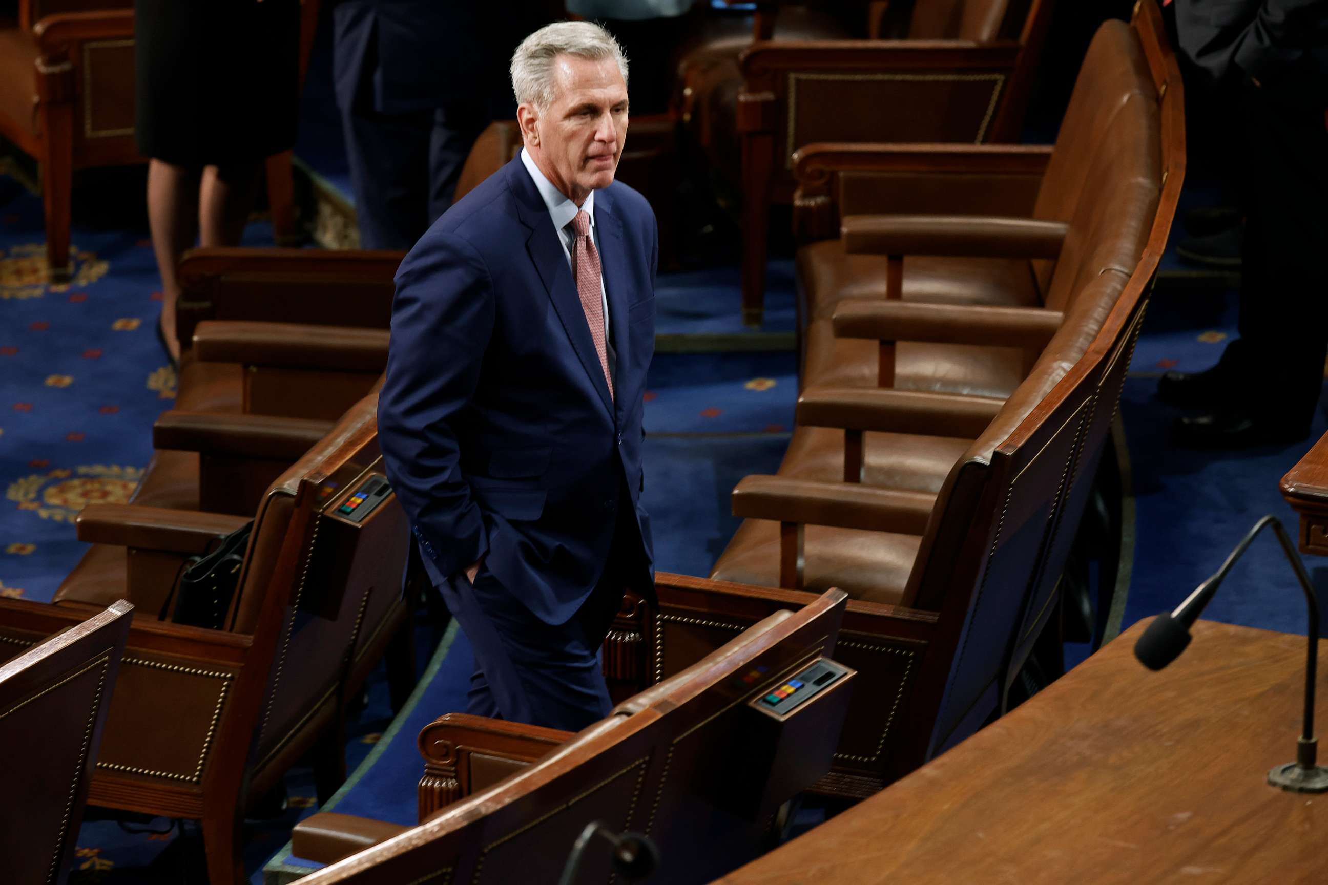 PHOTO: House Minority Leader Kevin McCarthy moves through the House Chamber in between roll call votes for Speaker of the House of the 118th Congress at the U.S. Capitol, Jan. 3, 2023, in Washington.