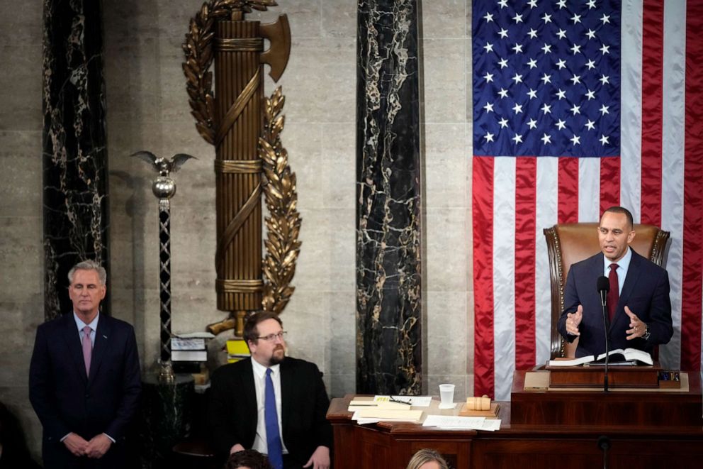 PHOTO: House Speaker-elect Rep. Kevin McCarthy listens as House Minority Leader Hakeem Jeffries speaks on the House floor at the U.S. Capitol in Washington, Jan. 7, 2023.