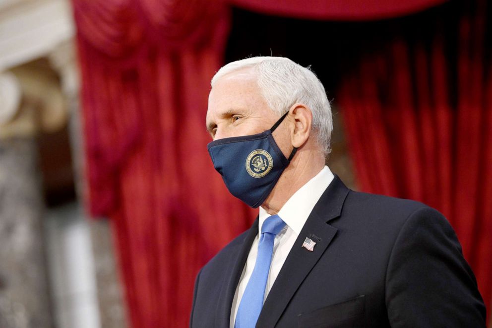 PHOTO: Vice President Mike Pence wears a face mask as participates in mock swearing-in ceremonies for Senators in the Old Senate Chambers at the Capitol Building Jan. 3, 2021.
