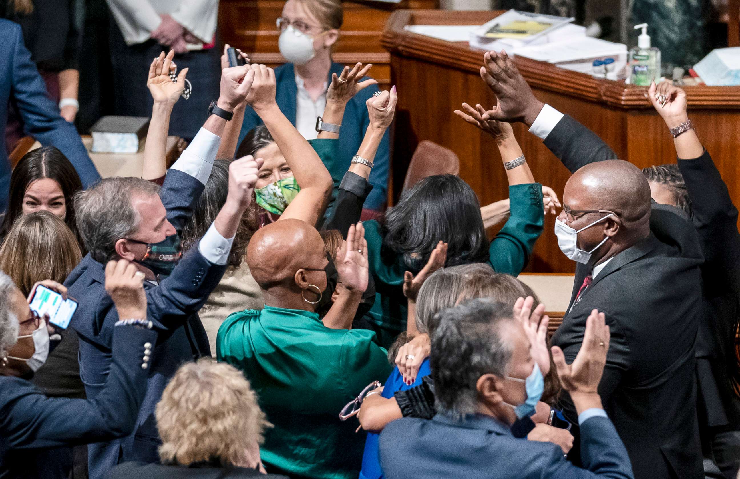 PHOTO: Democrats celebrate in the chamber as the House approves a sweeping social and environment bill, giving a victory to President Joe Biden, at the Capitol in Washington, Nov. 19, 2021.