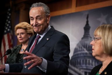 PHOTO: Senate Minority Leader Chuck Schumer speaks as Sens. Debbie Stabenow, left, and Patty Murray, right, listen during a news conference at the Capitol Dec. 21, 2017 in Washington, DC.