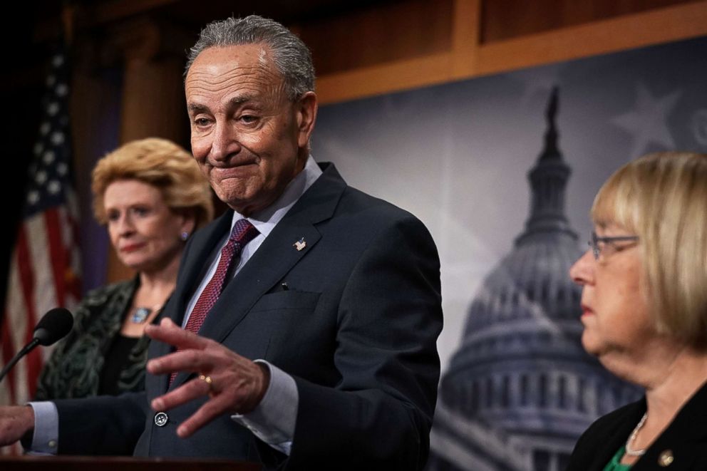 PHOTO: Senate Minority Leader Chuck Schumer speaks as Sens. Debbie Stabenow, left, and Patty Murray, right, listen during a news conference at the Capitol Dec. 21, 2017 in Washington, DC.