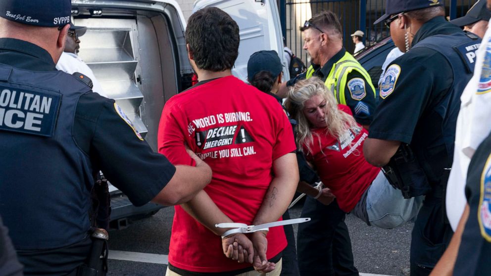 PHOTO: Climate activists are arrested after trying to get inside the stadium during a protest outside Nationals Park, where the annual Congressional Baseball Game for Charity is being held in Washington, July 28, 2022.