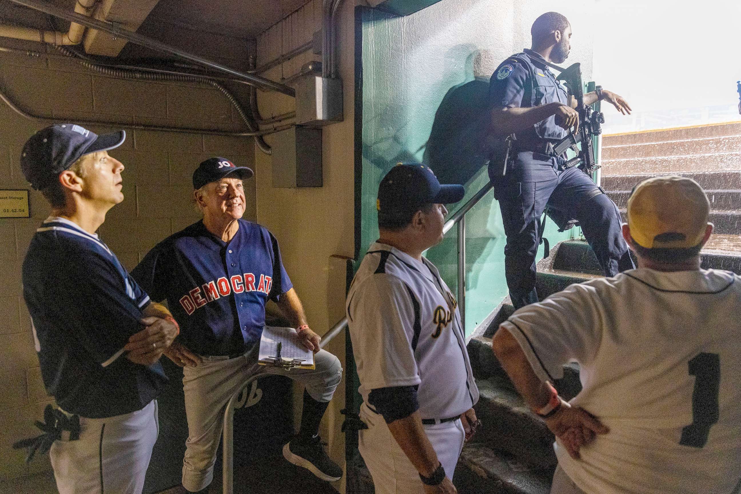 PHOTO: A U.S. Capitol Police Officer stands  guard during the rain delay at the Congressional Baseball Game for Charity at Nationals Park in Washington July 28, 2022.