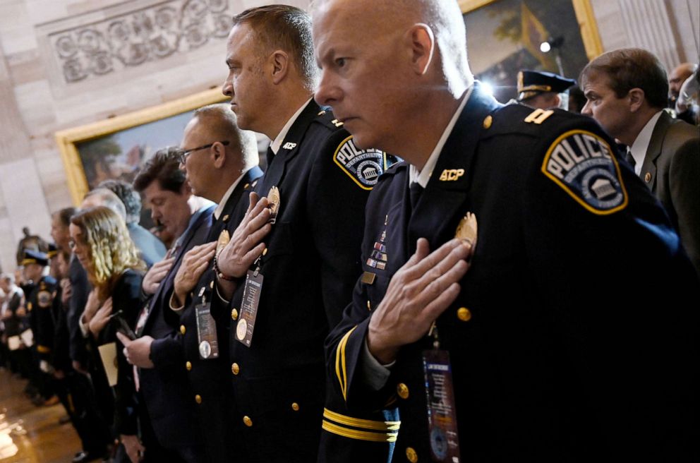 PHOTO: Police officers stand for the US National Anthem during a Congressional Gold Medal Ceremony in honor of the US Capitol Police and those who protected the Capitol on Jan. 6, 2021, in the US Capitol rotunda in Washington, Dec. 6, 2022.