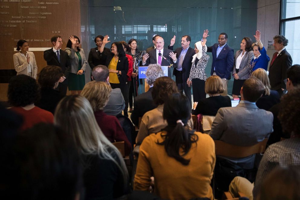 PHOTO: Incoming Democratic members of the House raise their hands at a Congressional Progressive Caucus news conference at the AFL-CIO International Headquarters in Washington, Nov. 12, 2018.