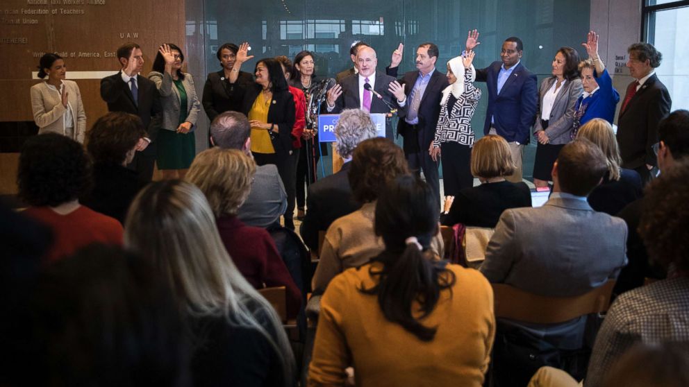 PHOTO: Incoming Democratic members of the House raise their hands at a Congressional Progressive Caucus news conference at the AFL-CIO International Headquarters in Washington, Nov. 12, 2018.