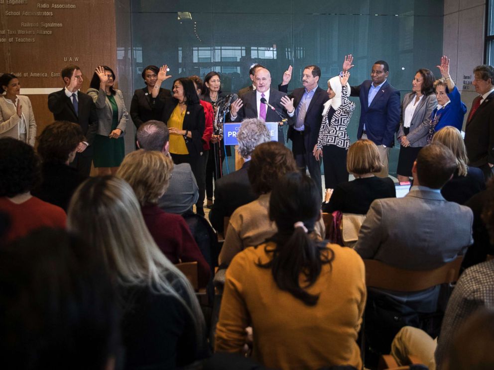PHOTO: Incoming Democratic members of the House raise their hands at a Congressional Progressive Caucus news conference at the AFL-CIO International Headquarters in Washington, Nov. 12, 2018.