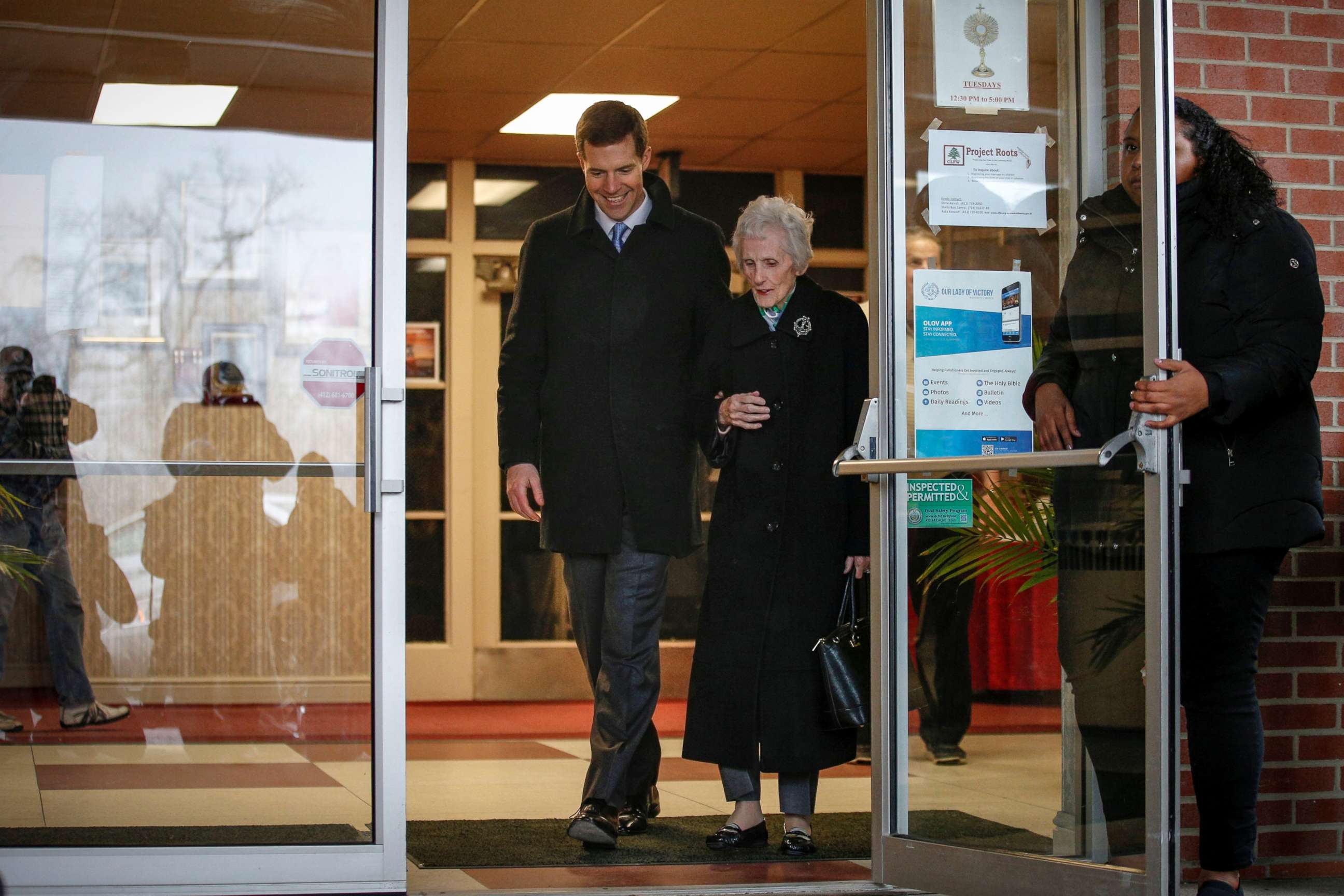 PHOTO: Democratic congressional candidate Conor Lamb exits after taking his his grandmother, Barbara Lamb, to vote in Carnegie, Pennsylvania, March 13, 2018.
