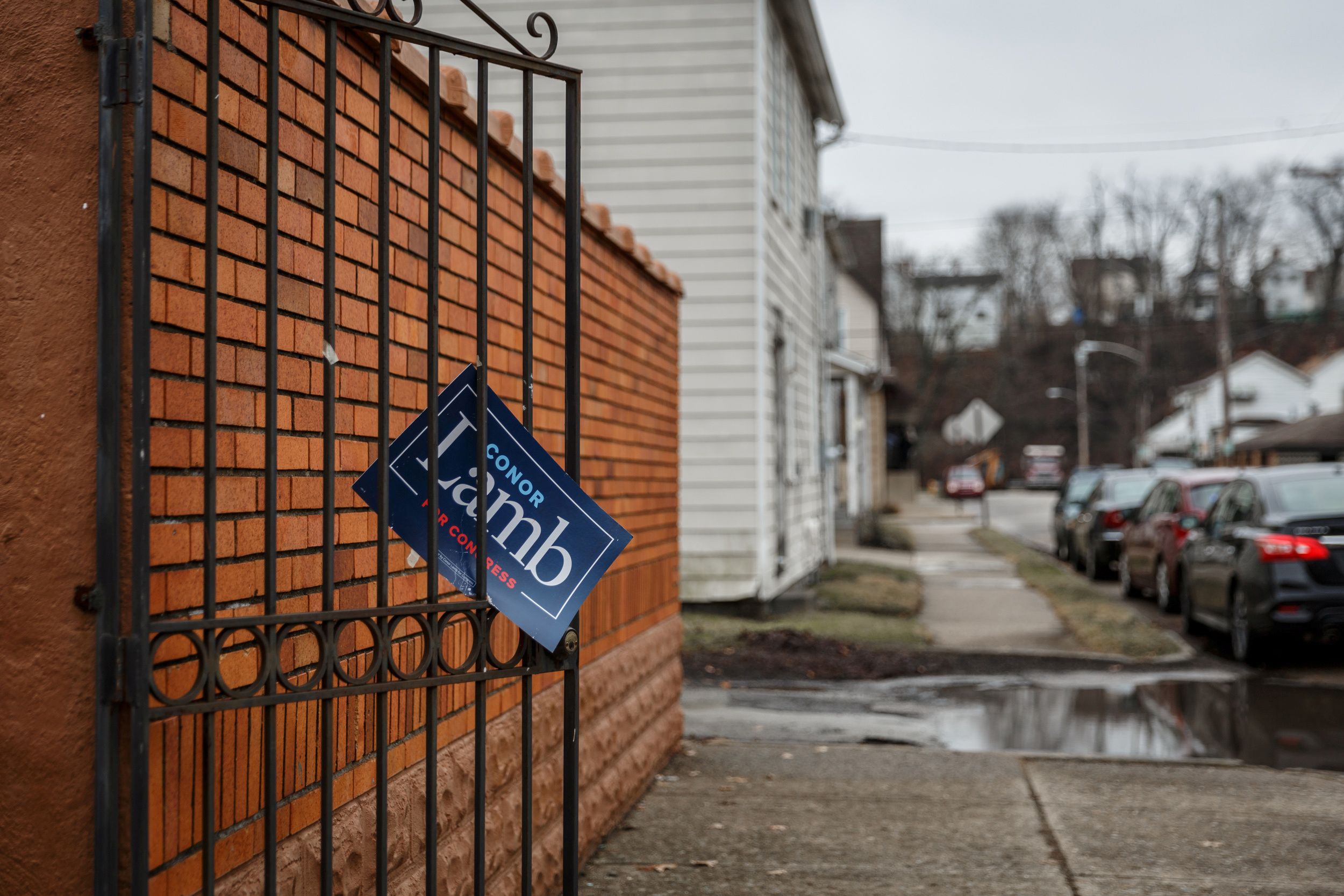 PHOTO: A sign showing support for Congressional candidate Conor Lamb hangs from a gate in the town of Carnegie, Pa., Feb. 16, 2018.