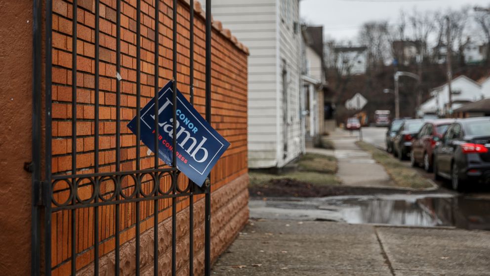 PHOTO: A sign showing support for Congressional candidate Conor Lamb hangs from a gate in the town of Carnegie, Pa., Feb. 16, 2018.