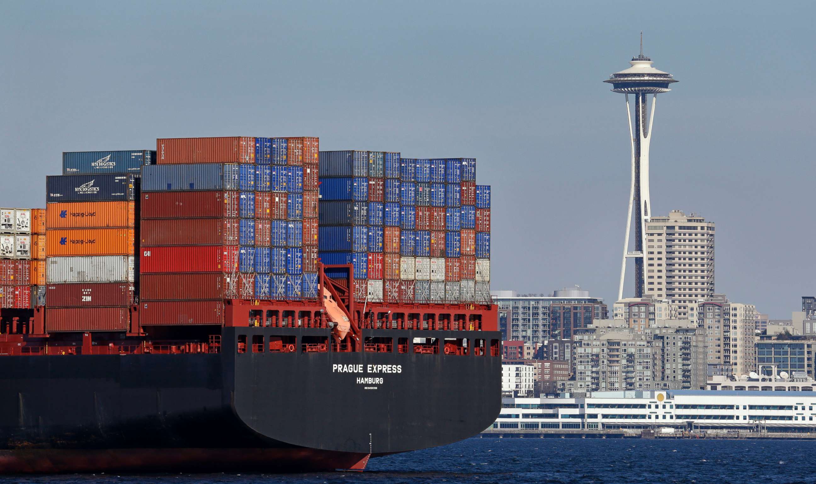 PHOTO: The Space Needle towers in the background beyond a container ship anchored in Elliott Bay near downtown Seattle, Feb. 15, 2015.