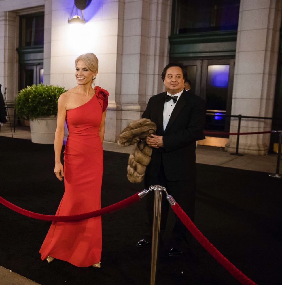 PHOTO: In this Jan. 19, 2017 file photo, President-elect Donald Trump adviser Kellyanne Conway, center, accompanied by her husband, George, speaks with members of the media as they arrive for a dinner at Union Station in Washington.