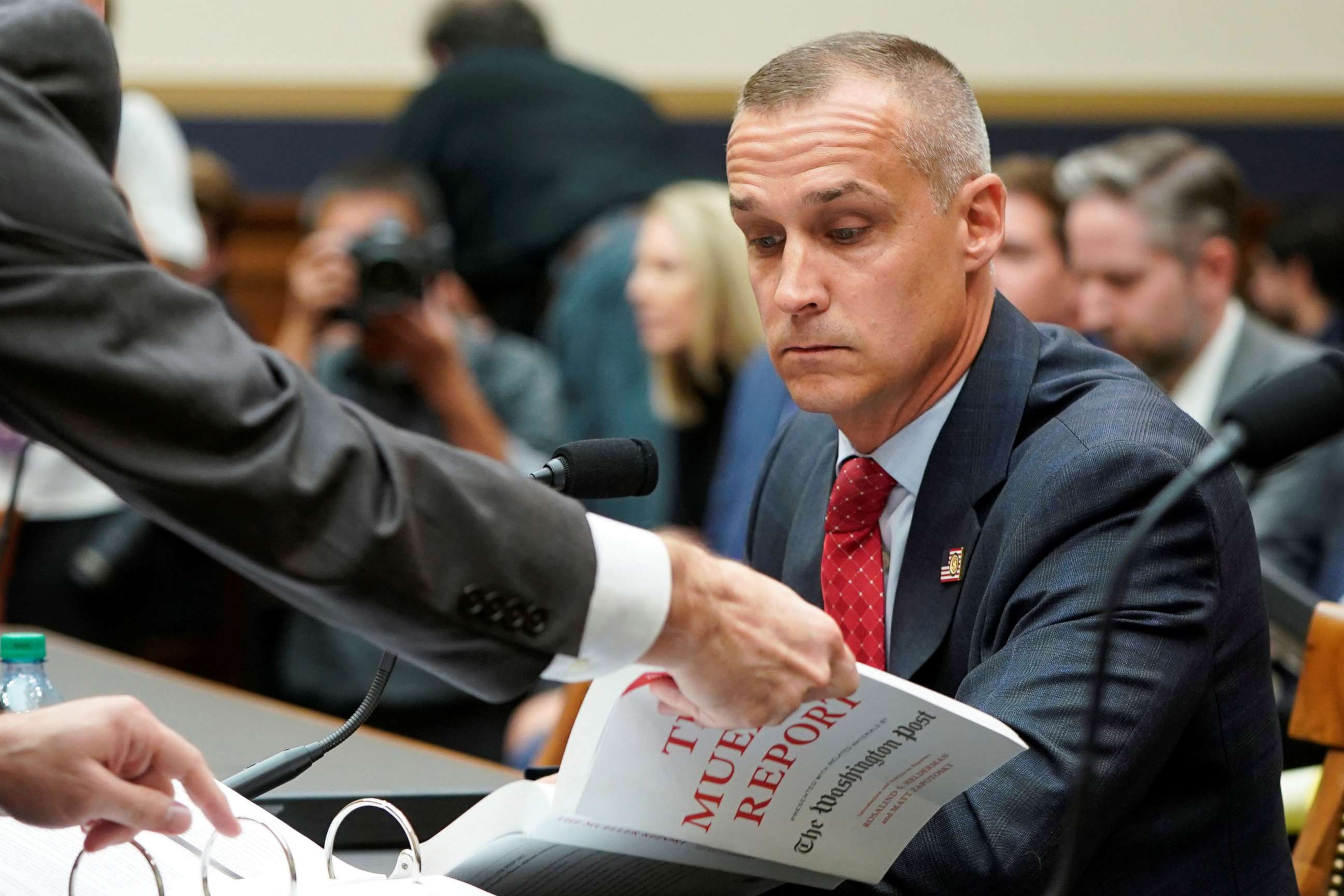 PHOTO: Corey Lewandowski, President Trump's former campaign manager and close confidant, is given a copy of the Mueller Report as he testifies before the U.S. House Judiciary Committee on Capitol Hill in Washington, Sept.17, 2019.