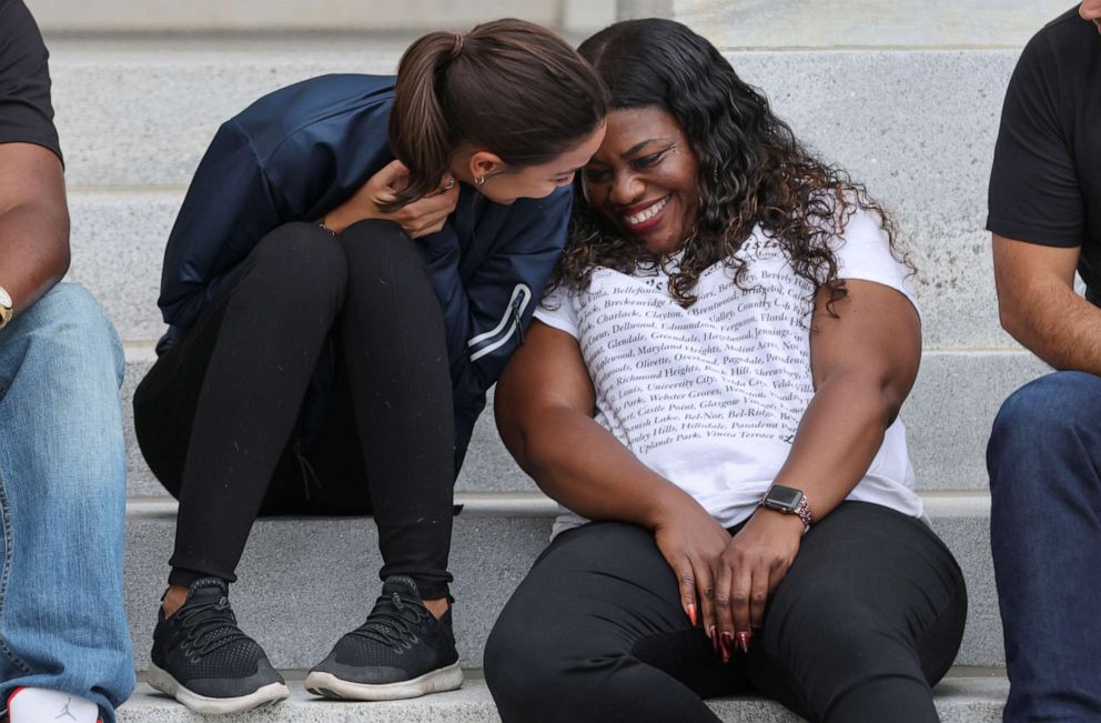 PHOTO: Rep. Alexandria Ocasio-Cortez sits on the steps of the U.S. Capitol with Rep. Cori Bush as they celebrate news that the White House intends to extend the eviction moratorium, on Capitol Hill in Washington, Aug. 3, 2021.