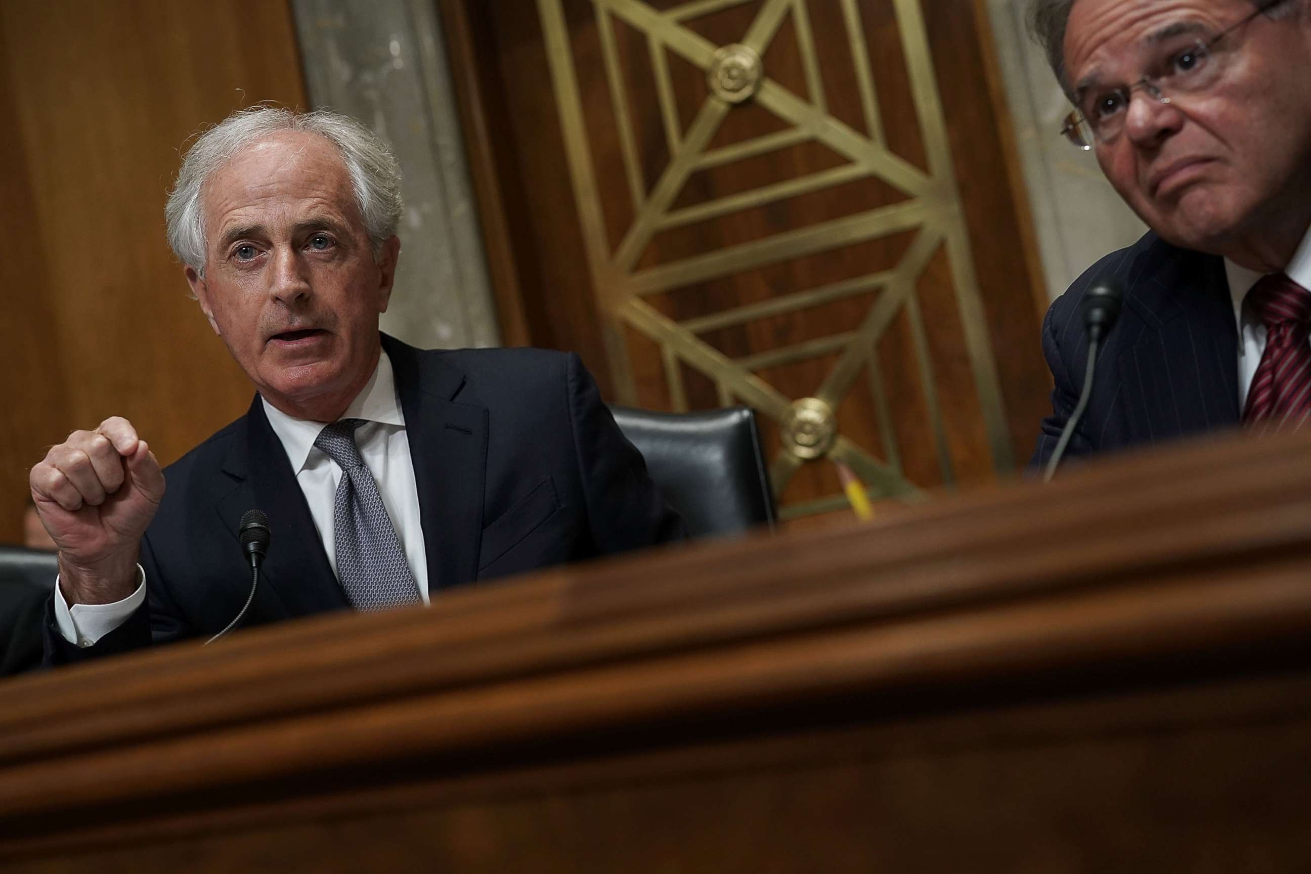 PHOTO: Sen. Bob Corker (R-TN) (L), chairman of the Senate Foreign Relations Committee, speaks as ranking member Sen. Bob Menendez (D-NJ) (R) listens during a committee meeting April 23, 2018 on Capitol Hill. 