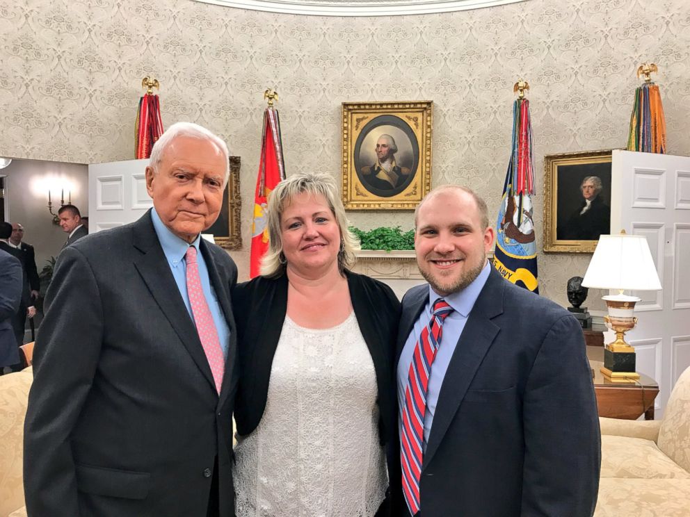 Sen. Orrin Hatch, R-Utah, left, meets with freed Venezuelan prisoner Josh Holt, right, and his mother, Laurie, in the Oval Office on Saturday, May 26, 2018.