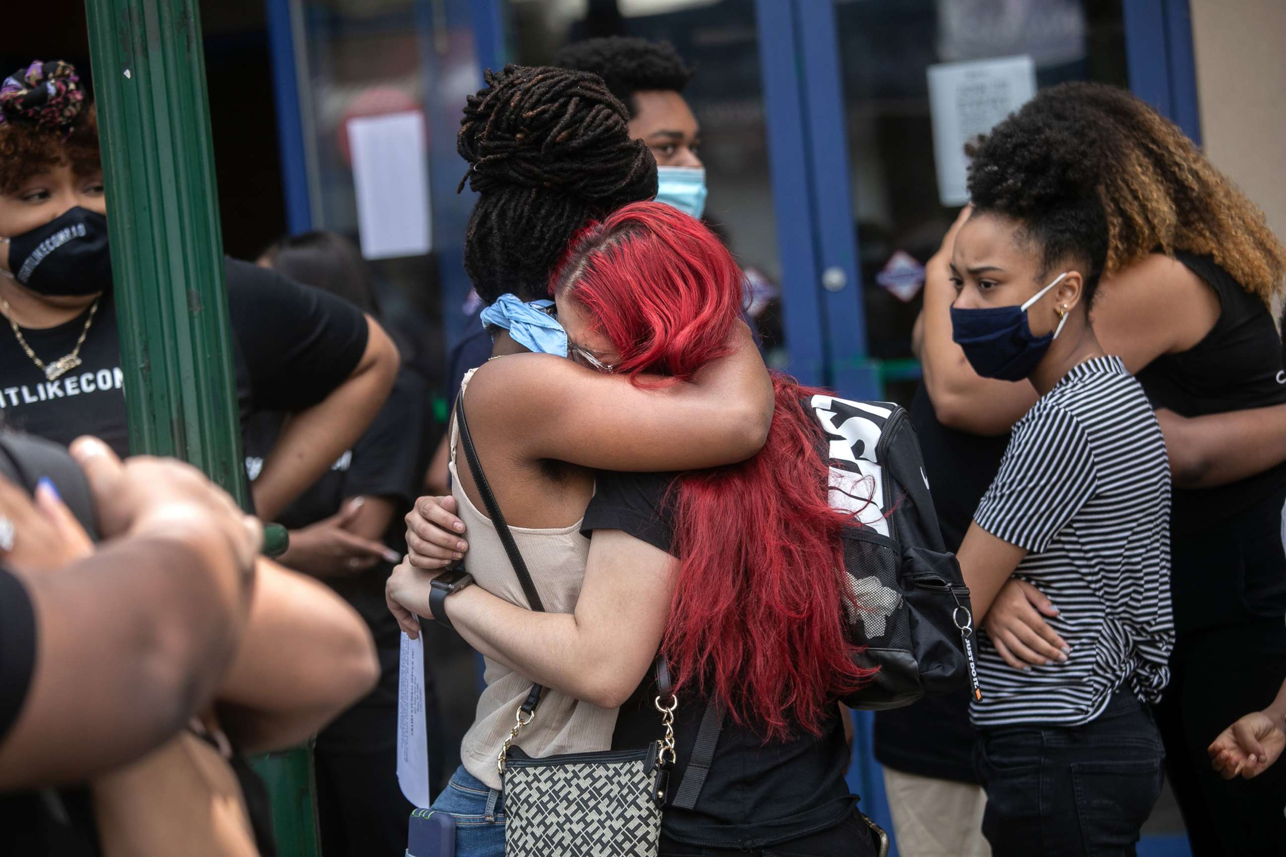 PHOTO: Friends and family mourn the death of Conrad Coleman Jr. following his funeral service, July 3, 2020, in New Rochelle, N.Y. Coleman, 39, died of COVID-19.