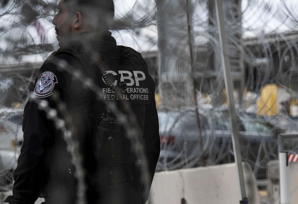 PHOTO: Customs and Border Patrol officers patrol as travelers wait to cross into the United States at the San Ysidro Port of Entry border crossing in Tijuana, Baja California, Mexico, March 20, 2020.