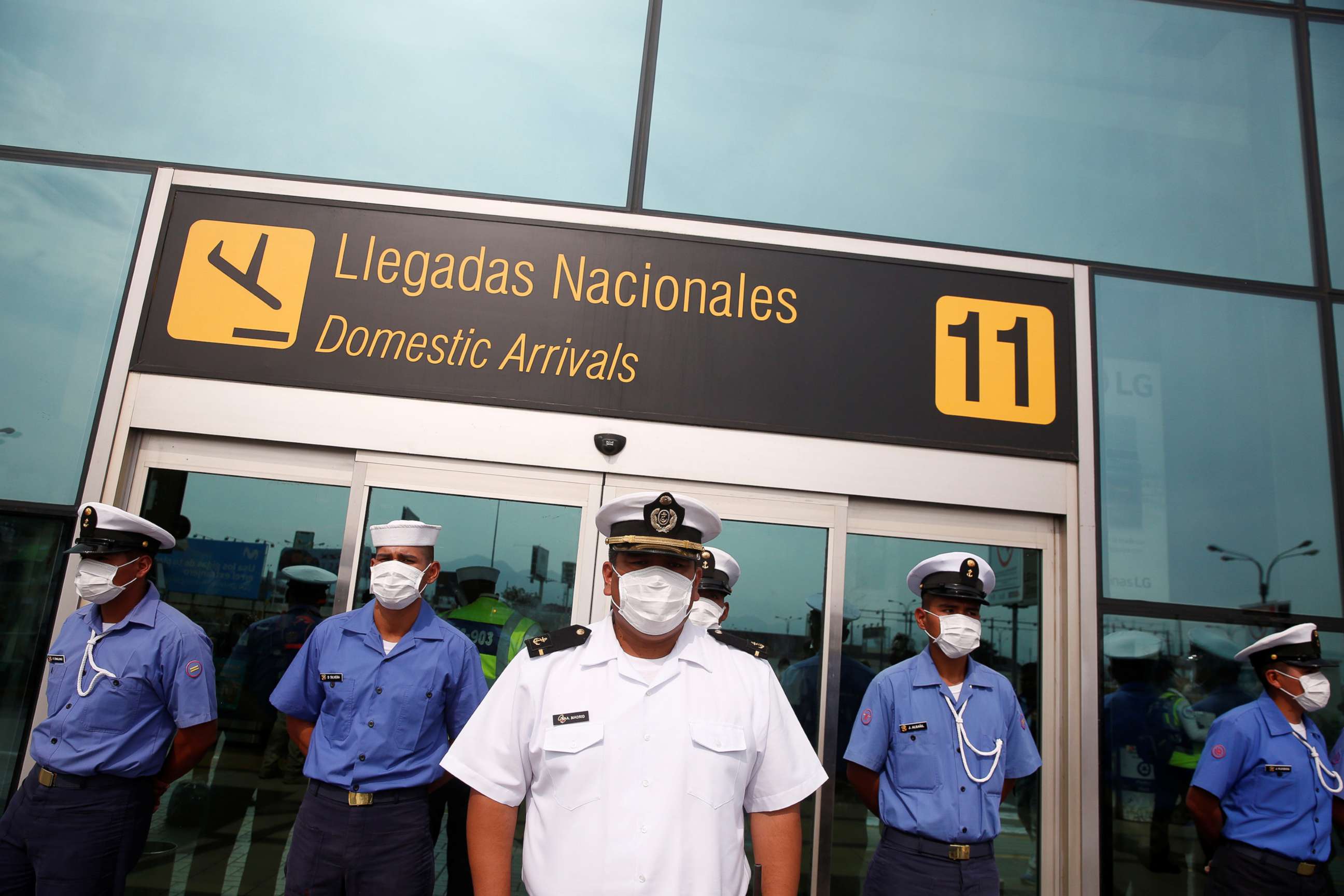 PHOTO: Sailors with the Peruvian Navy stand guard outside Jorge Chavez International Airport after the Peruvian government closed the country's borders in response to the coronavirus outbreak, in Lima, Peru, on March 17, 2020.