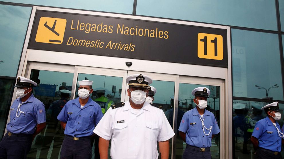 PHOTO: Sailors with the Peruvian Navy stand guard outside Jorge Chavez International Airport after the Peruvian government closed the country's borders in response to the coronavirus outbreak, in Lima, Peru, on March 17, 2020.