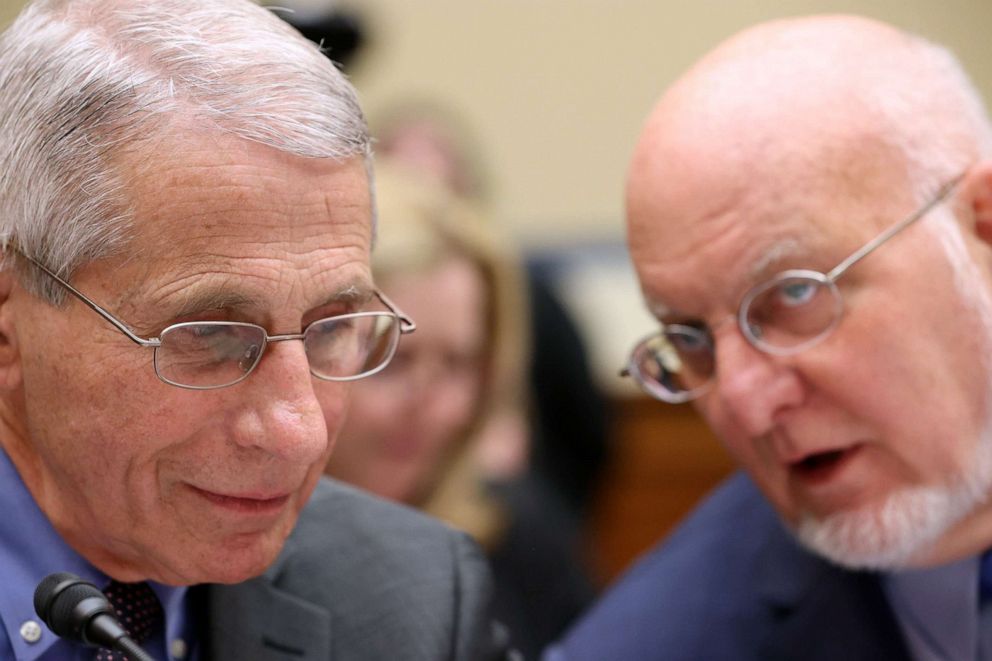 PHOTO: Anthony Fauci speaks with Robert Redfield during a House Oversight and Reform Committee hearing on Coronavirus Preparedness and Response at the Rayburn House Office Building, March 12, 2020, in Washington, DC. 