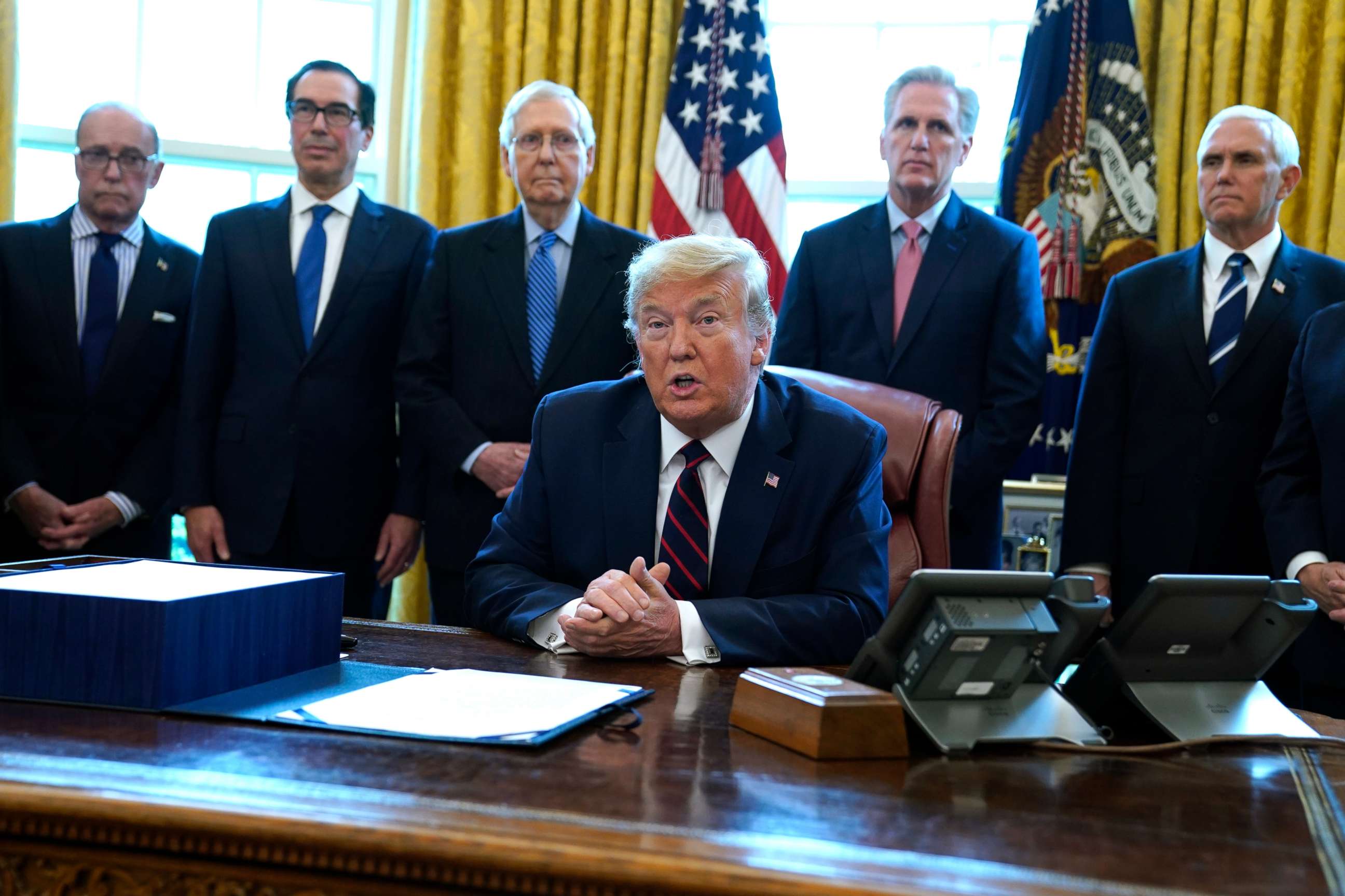 PHOTO: President Donald Trump speaks before he signs the coronavirus stimulus relief package in the Oval Office at the White House, Friday, March 27, 2020, in Washington.