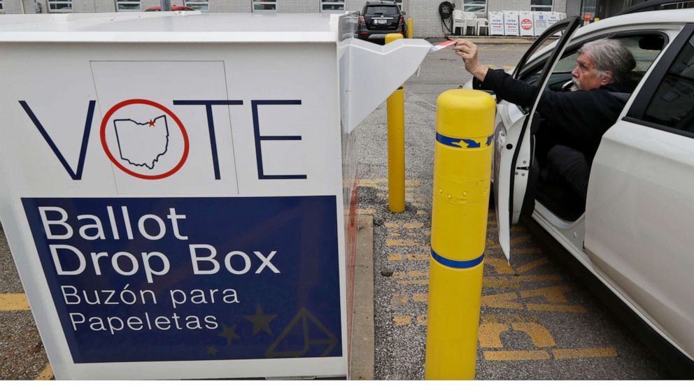 PHOTO: Jim O'Bryan drops of his election ballot in the drop box at the Cuyahoga County Board of Elections, Wednesday, April 22, 2020, in Cleveland.