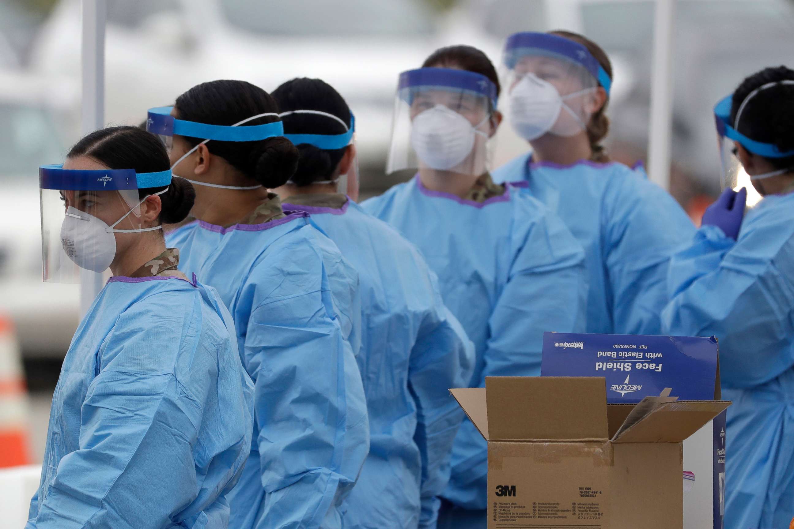 PHOTO: Another shift of medical staff prepare to start woking at a drive-through testing center for COVID-19 in Paramus, N.J., March 20, 2020.