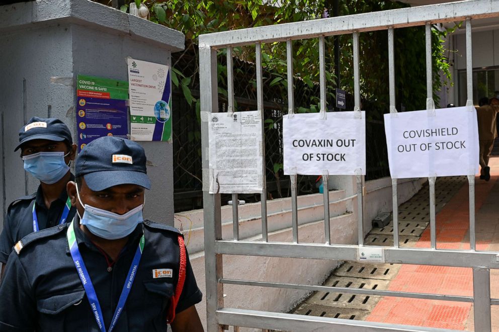 PHOTO: Security guards stand next to signs announcing that vaccines are out of stock outside a COVID-19 coronavirus vaccination center closed for three days due to shortage of vaccine supplies, in Mumbai on April 30, 2021.