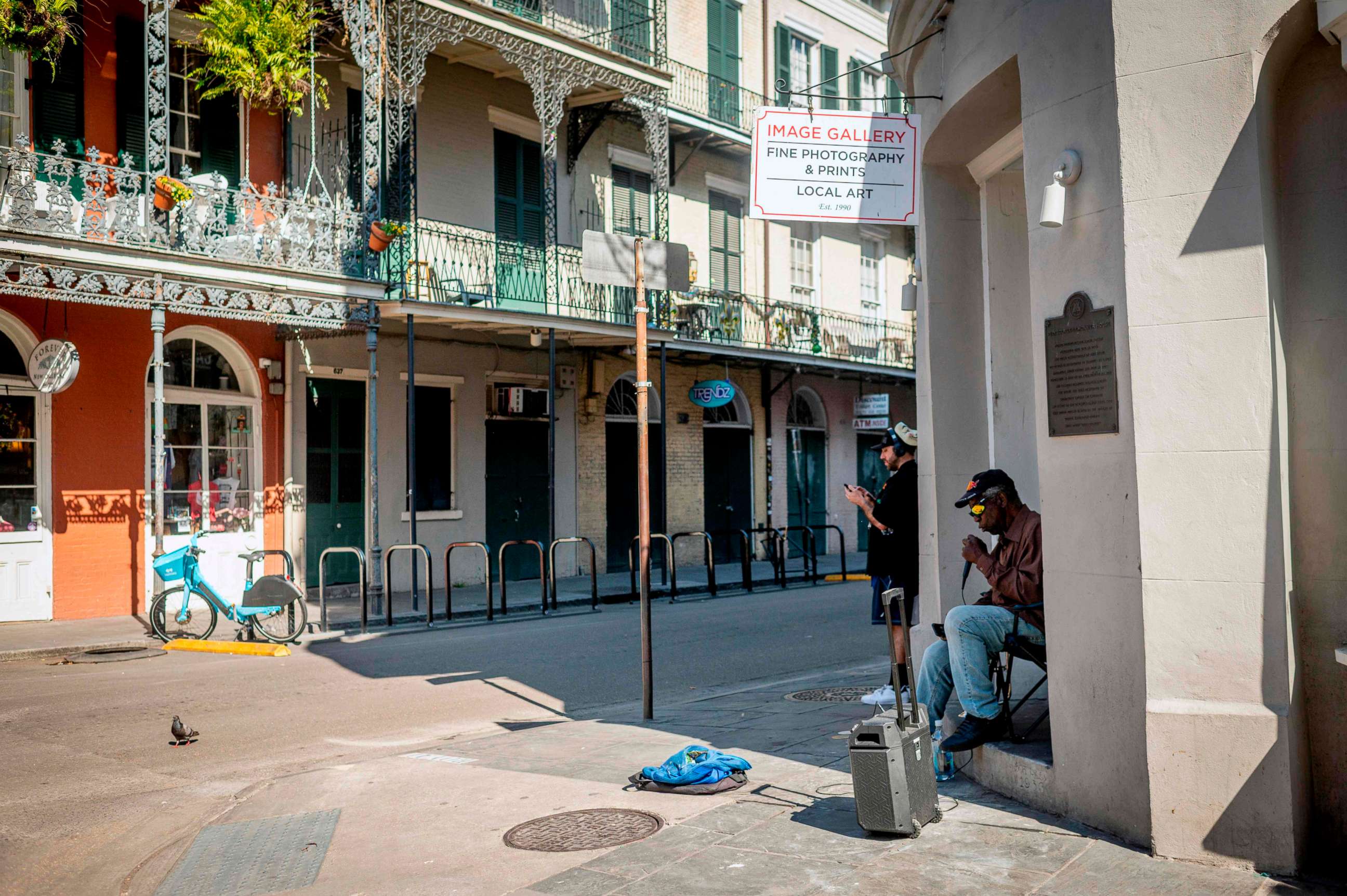 PHOTO: A man sings on a corner of the French Quarter in New Orleans, on March 26, 2020.