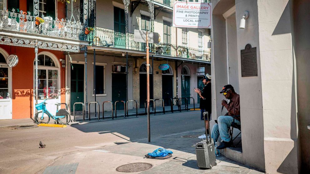 PHOTO: A man sings on a corner of the French Quarter in New Orleans, on March 26, 2020.