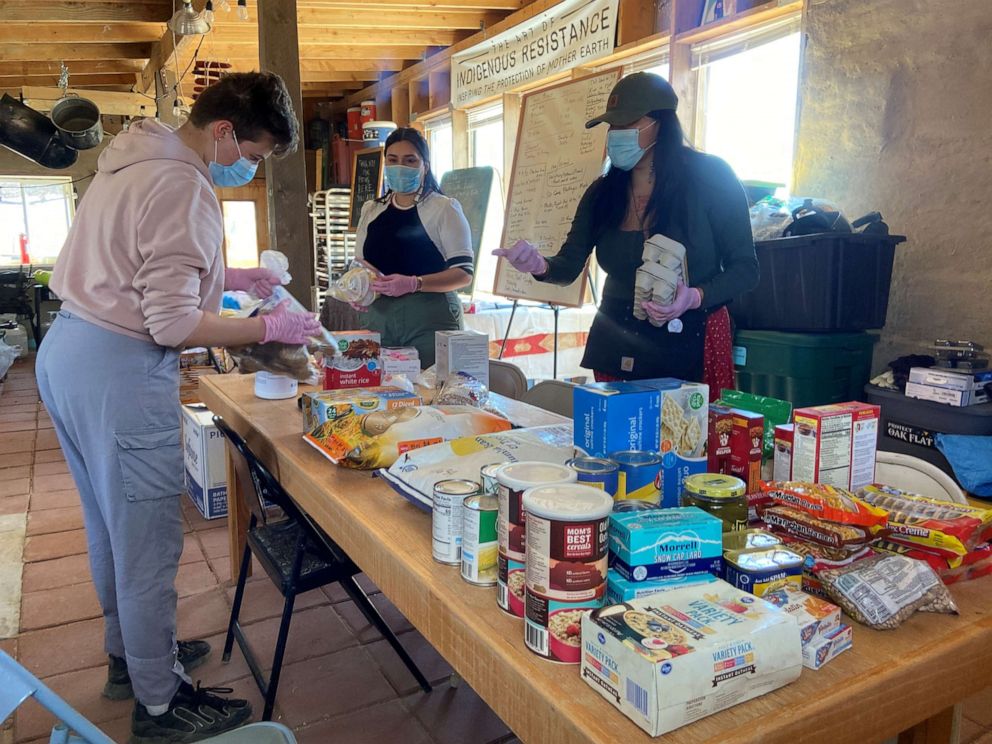 PHOTO: Relief workers prepare supplies at a farm, used as a base for aid to Navajo families quarantined in their homes due to the coronavirus disease near Shiprock, N.M., April 7, 2020.