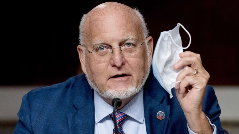 PHOTO: Centers for Disease Control and Prevention Director Dr. Robert Redfield holds up his mask as he speaks at a Senate Appropriations subcommittee hearing on Capitol Hill, in Washington, Sept. 16, 2020.