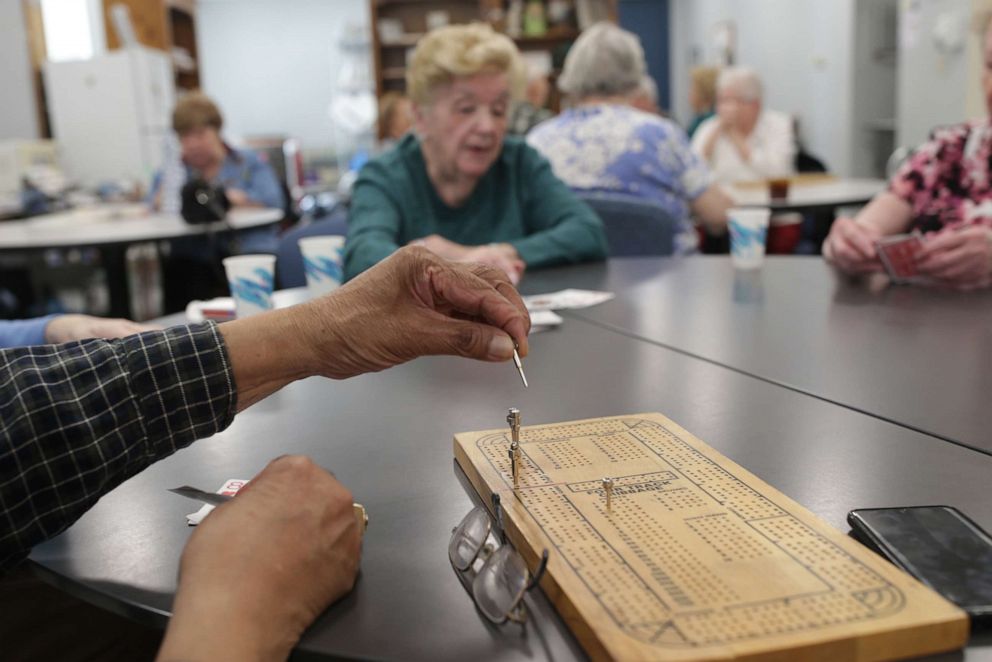 PHOTO: A group plays cribbage at the Billlerica Senior Center in Billerica, Mass., March 12, 2020.