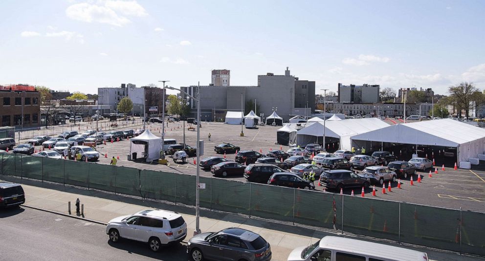 PHOTO: Cars line up at a newly set up COVID-19 testing site in Brooklyn, New York, April 16, 2020. 