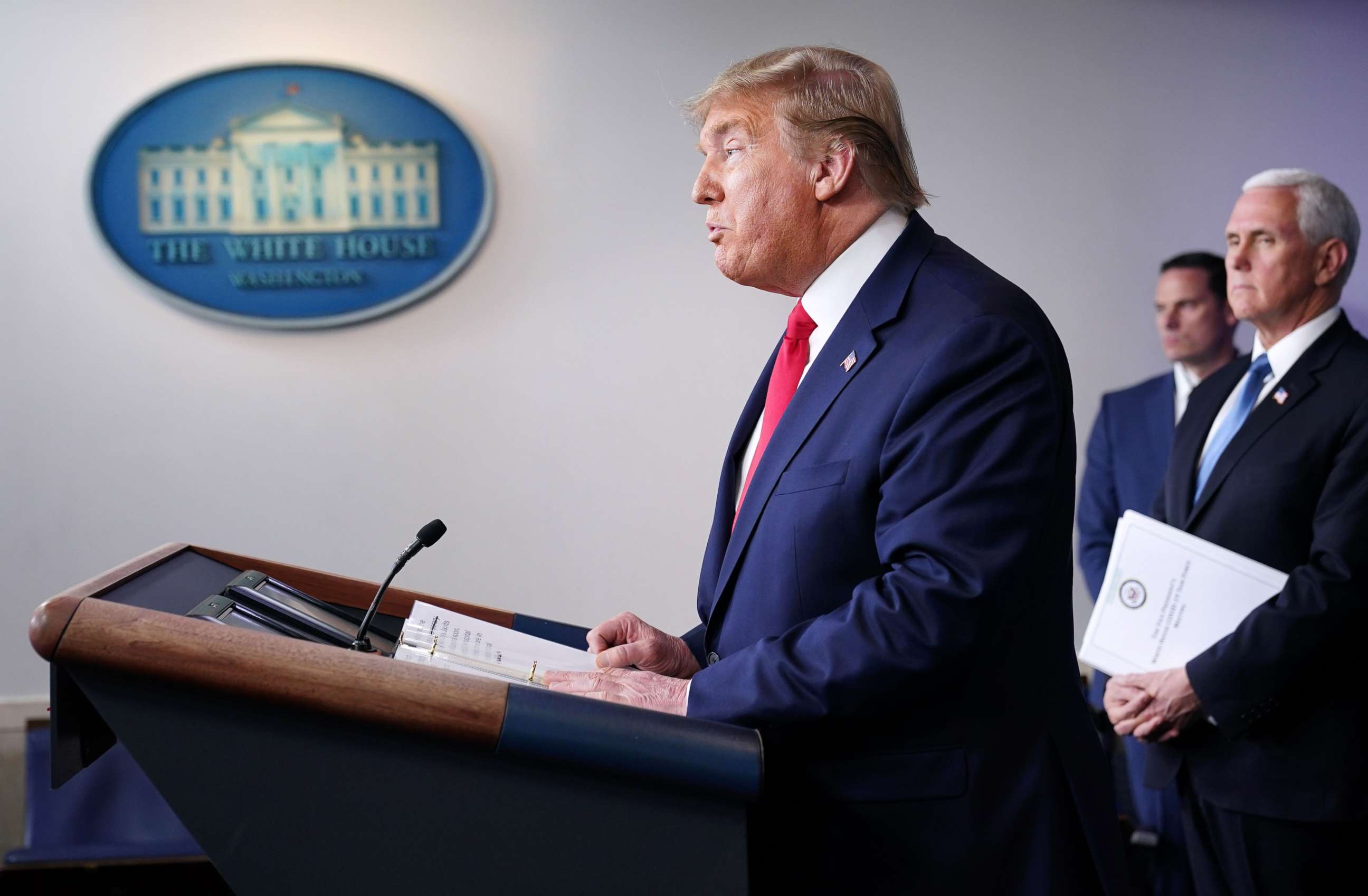 PHOTO: President Donald Trump, flanked by Vice President Mike Pence, speaks during the daily briefing on the novel coronavirus, COVID-19, at the White House on March 24, 2020, in Washington.