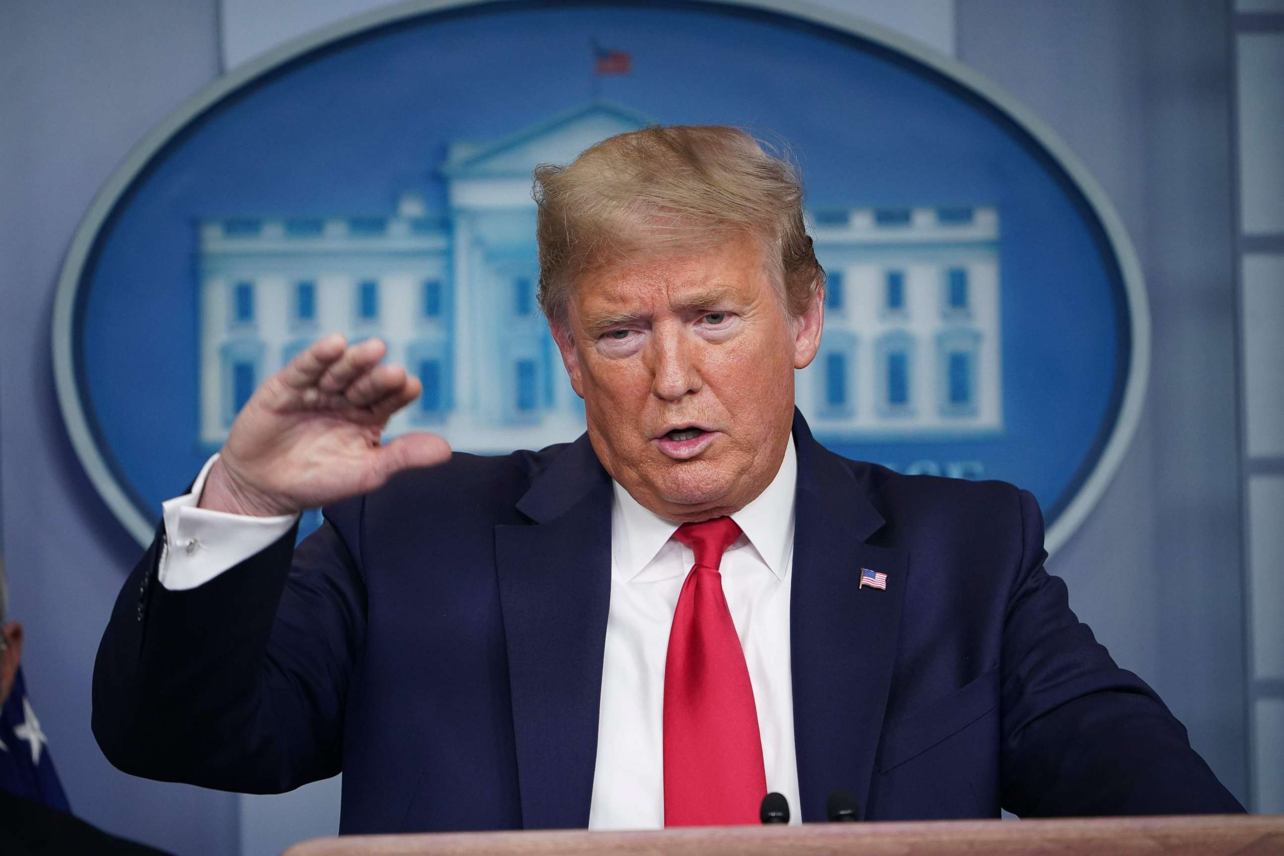 PHOTO: President Donald Trump answers a questions during the daily briefing on the novel coronavirus, COVID-19, at the White House on March 24, 2020, in Washington.