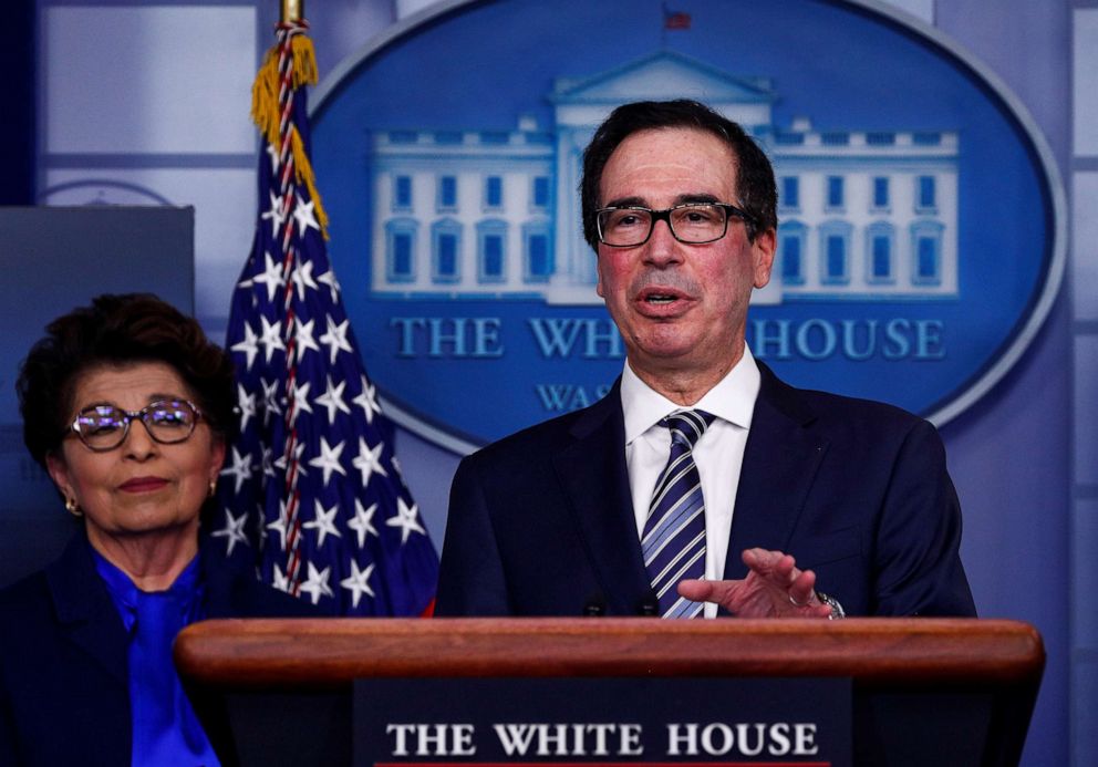 PHOTO: Treasury Secretary Steven Mnuchin discusses details for economic relief during the daily coronavirus response briefing as Small Business Administrator Jovita Carranza listens at the White House in Washington, April 2, 2020.